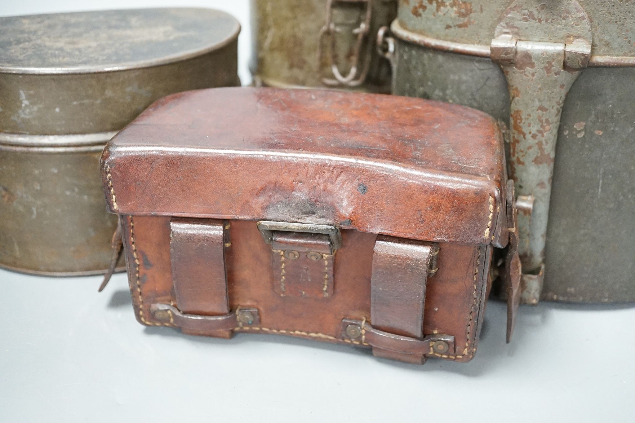WWI German gas mask, two German trench mess tins and a German leather belt case